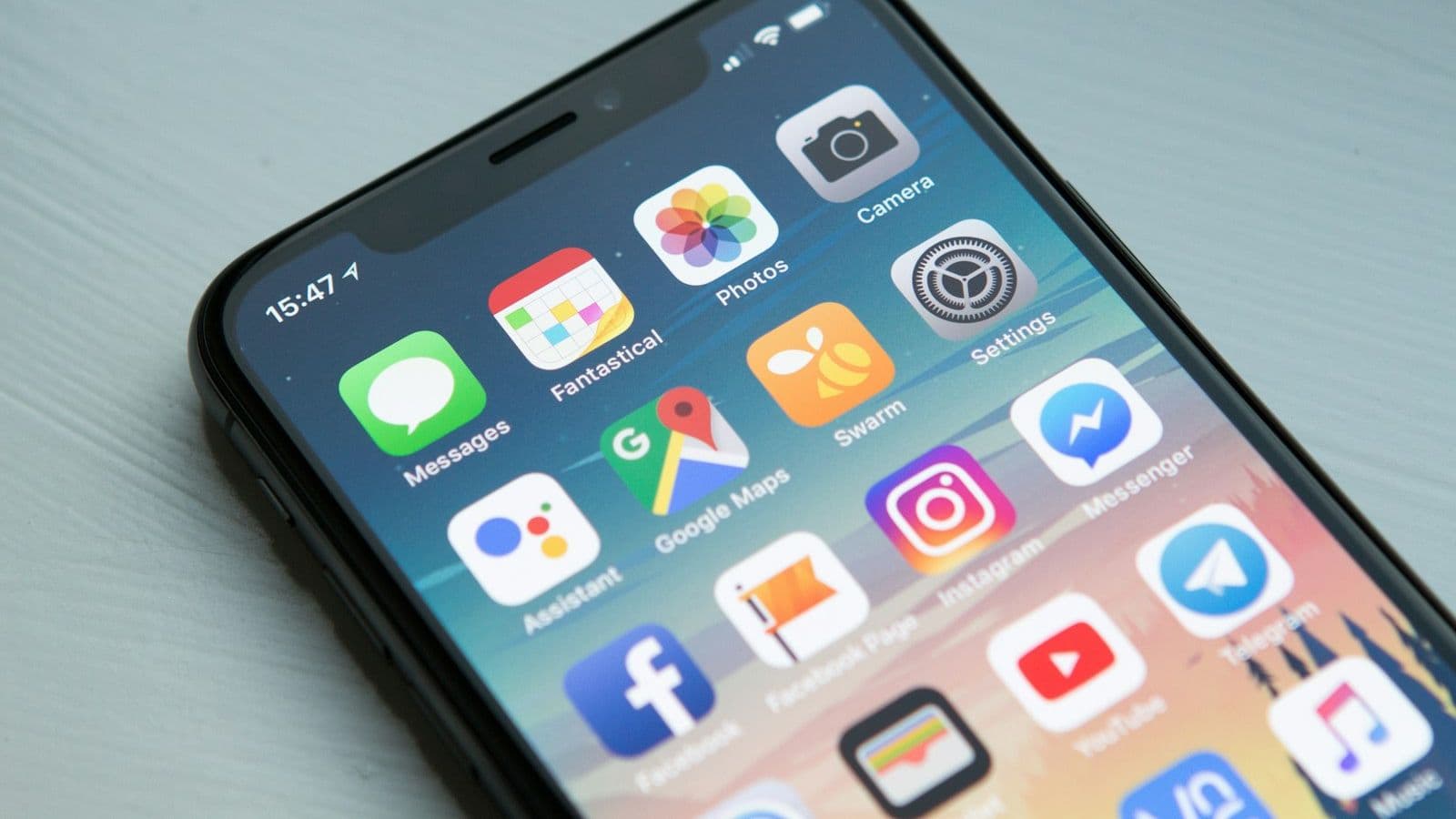 A close view of a phone home screen filled with app icons.